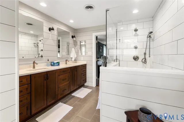 a view of a patio with couches chairs and potted plants