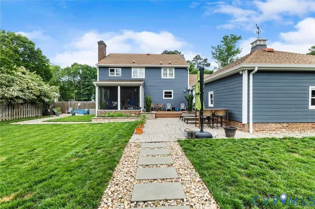 a front view of a house with garden and porch