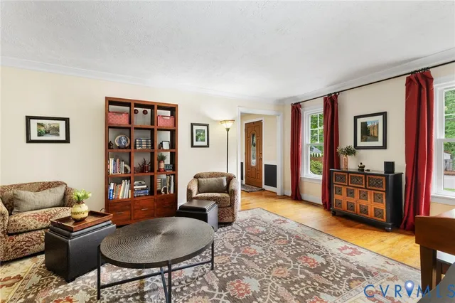 a livingroom with workspace and a couch