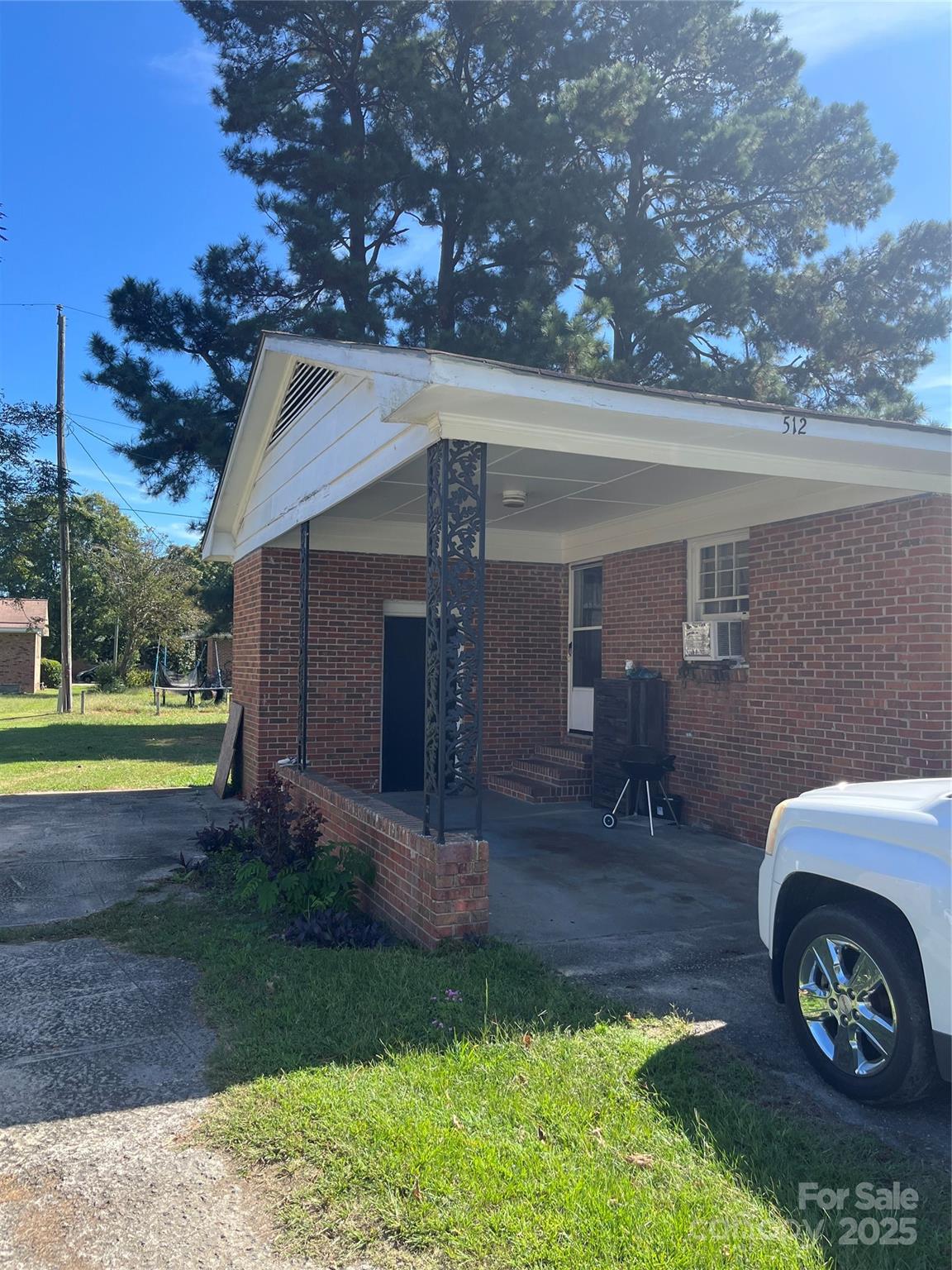 512 Produce Market Road Laurinburg, NC 28352 - Photo 10 of 10 a view of a house with a back yard