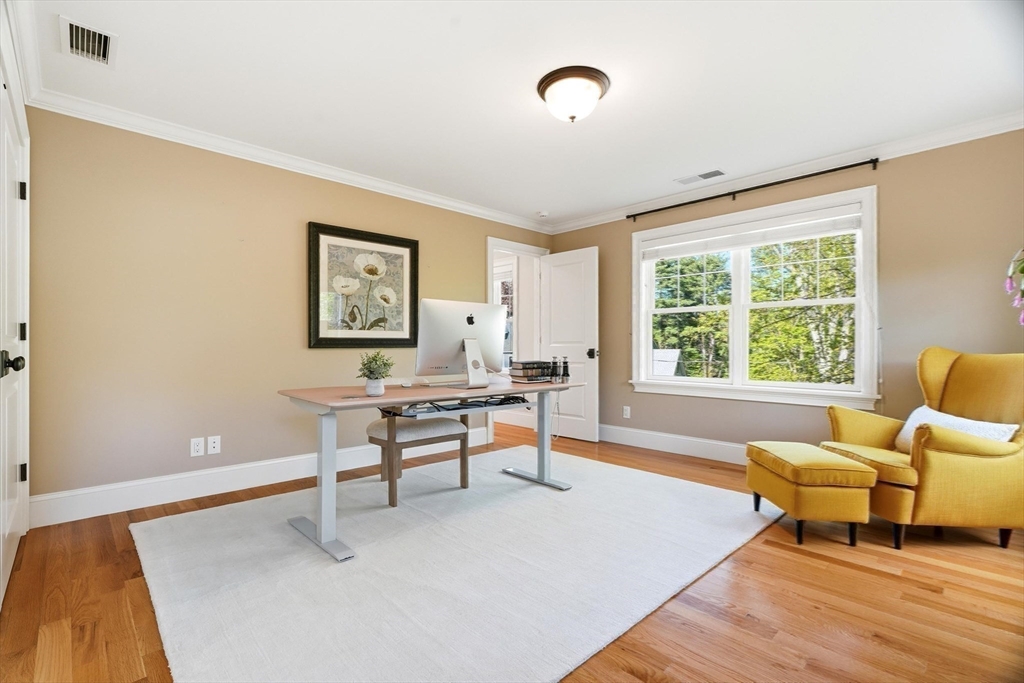 6 Flintlock Road Lexington, MA 02420 - Photo 28 of 39 a living room with furniture and a large window