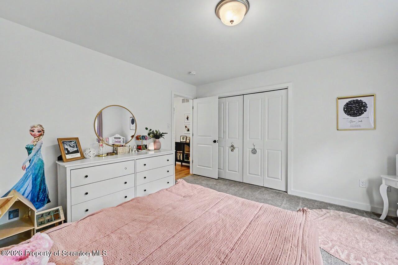 100 Highland Road Moscow, PA 18444 - Photo 59 of 85 a bed room with a bed and a dresser