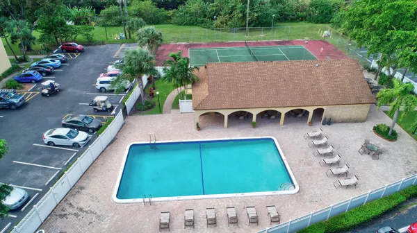a view of a swimming pool with a lounge chairs