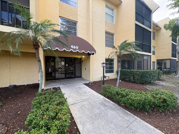 a view of a building with a yard