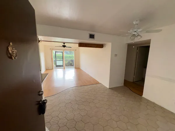 an entryway of a room with windows