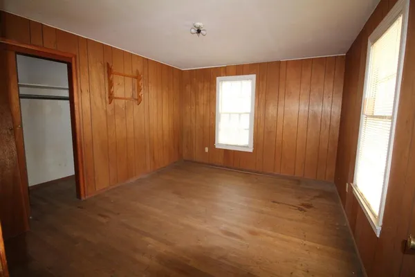 a view of an empty room with windows