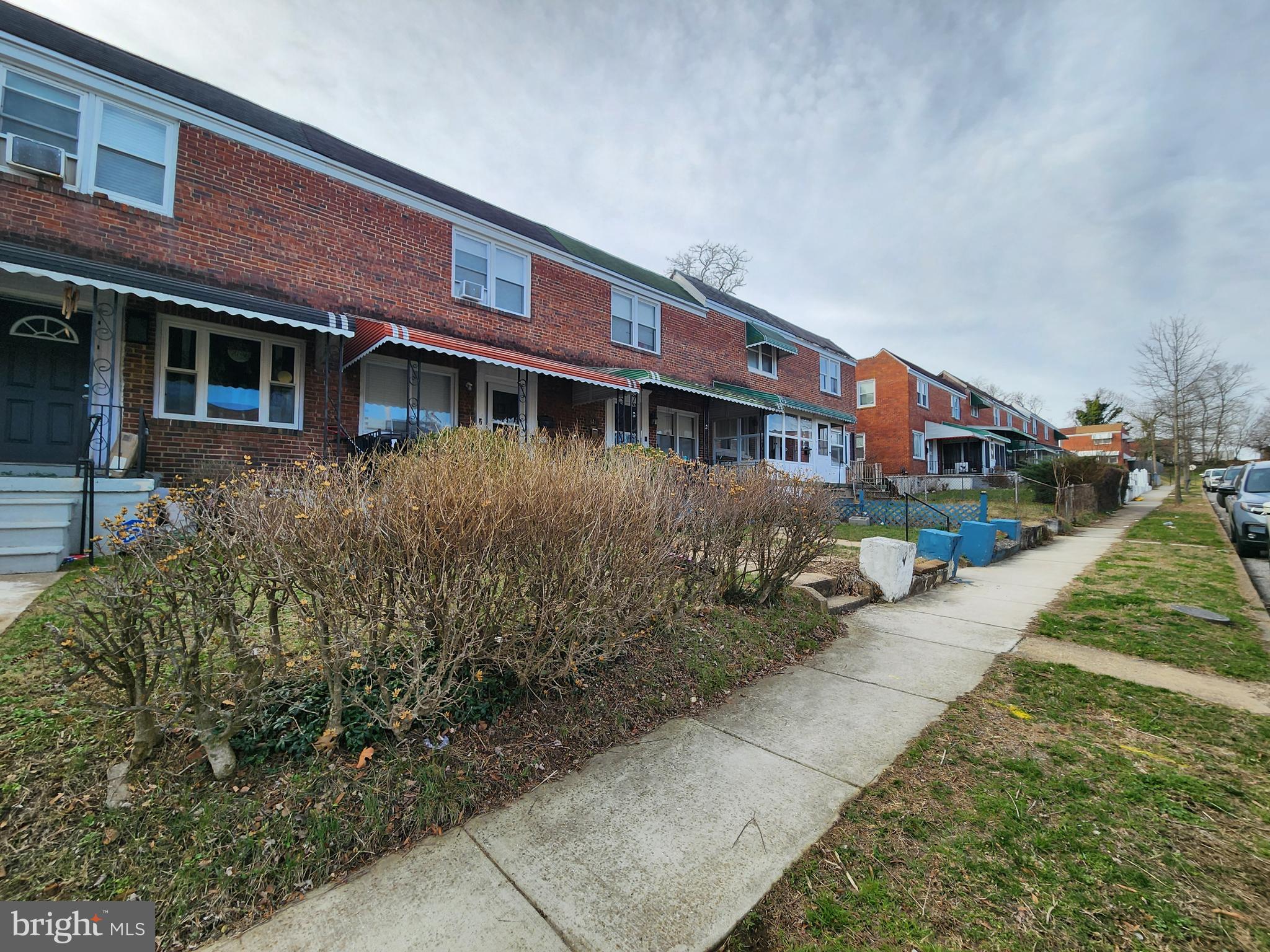 627 Cheraton Road Baltimore, MD 21225 - Photo 4 of 5 a front view of a building with a yard