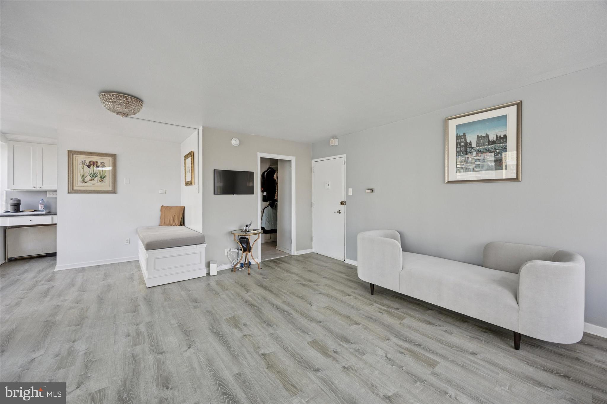 224 West Rittenhouse Square, Unit 715A Philadelphia, PA 19103 - Photo 6 of 47 a living room with furniture and a wooden floor