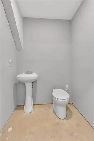 a view of a room with wooden floor and window