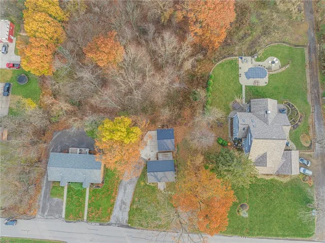 a view of a garden with an outdoor seating