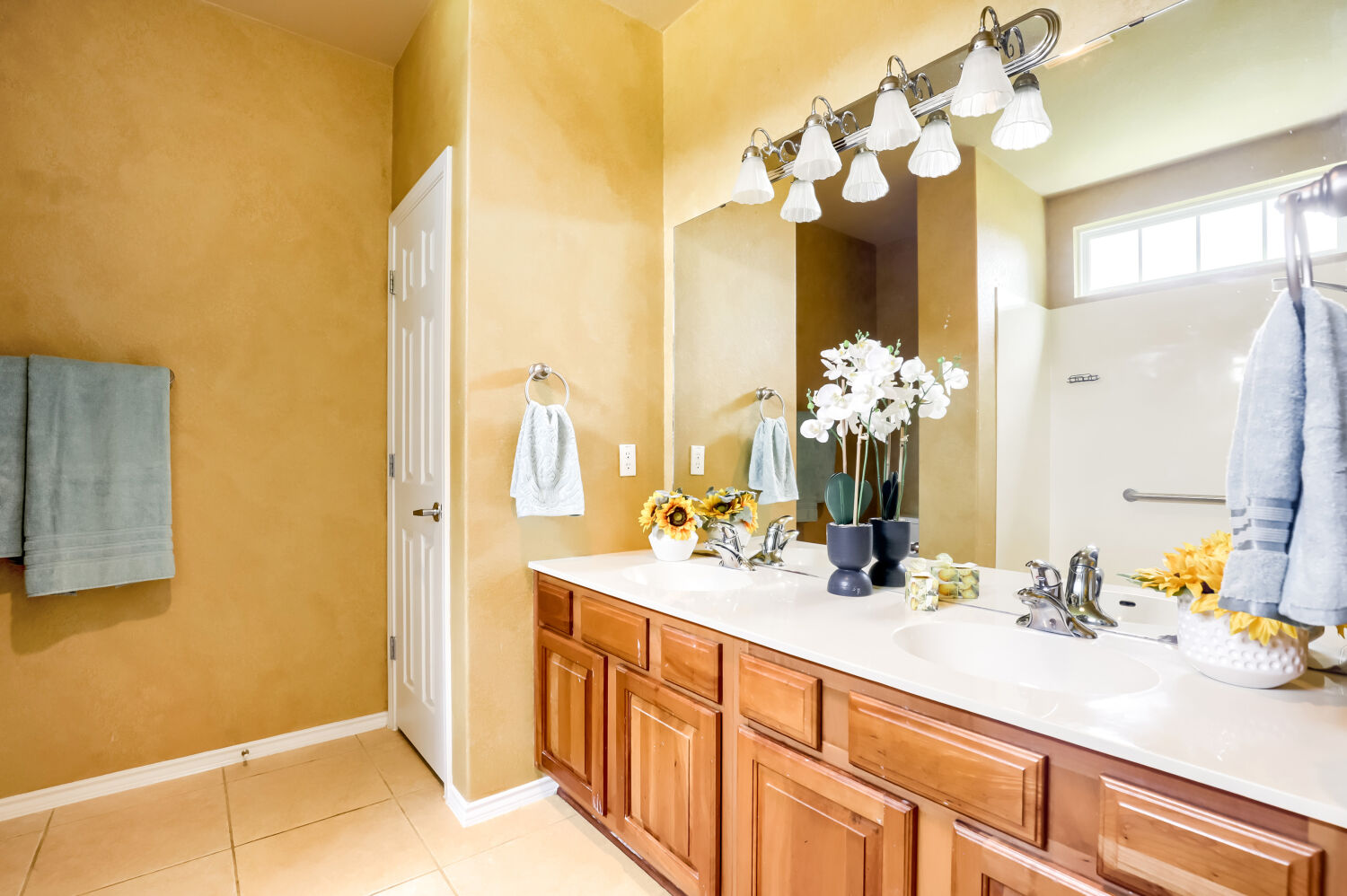 310 Crockett Loop Georgetown, TX 78633 - Photo 11 of 22 Dual sinks and updated lighting in the primary bathroom. Cherry wood cabinets.