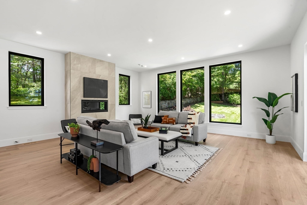 17 Prospect Hill Road Lexington, MA 02421 - Photo 11 of 42 a living room with furniture and large windows