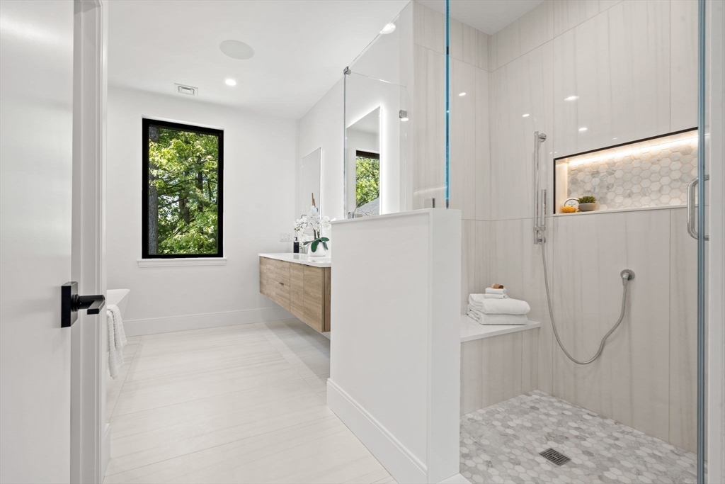 17 Prospect Hill Road Lexington, MA 02421 - Photo 29 of 42 a bathroom with a bathtub and shower