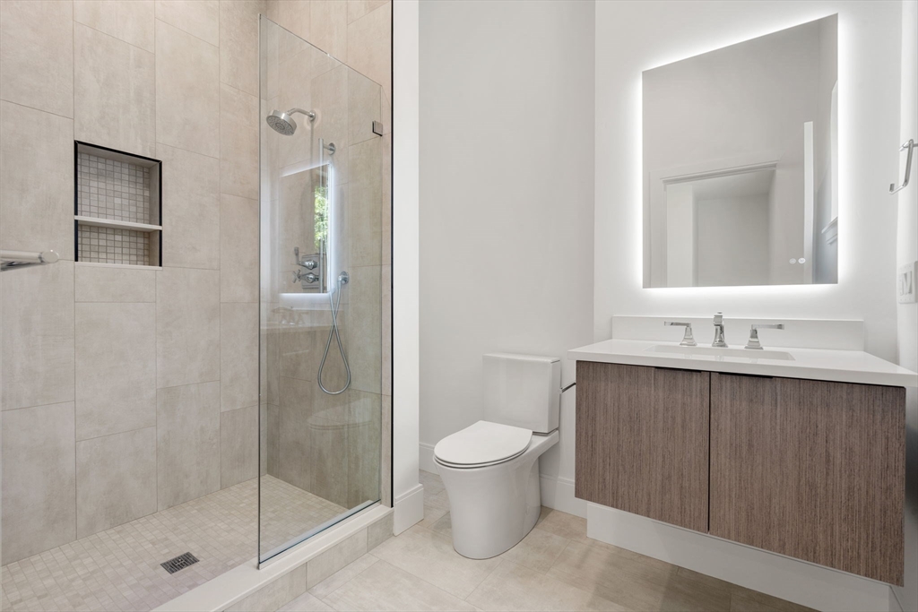 17 Prospect Hill Road Lexington, MA 02421 - Photo 33 of 42 a bathroom with a shower sink vanity and toilet