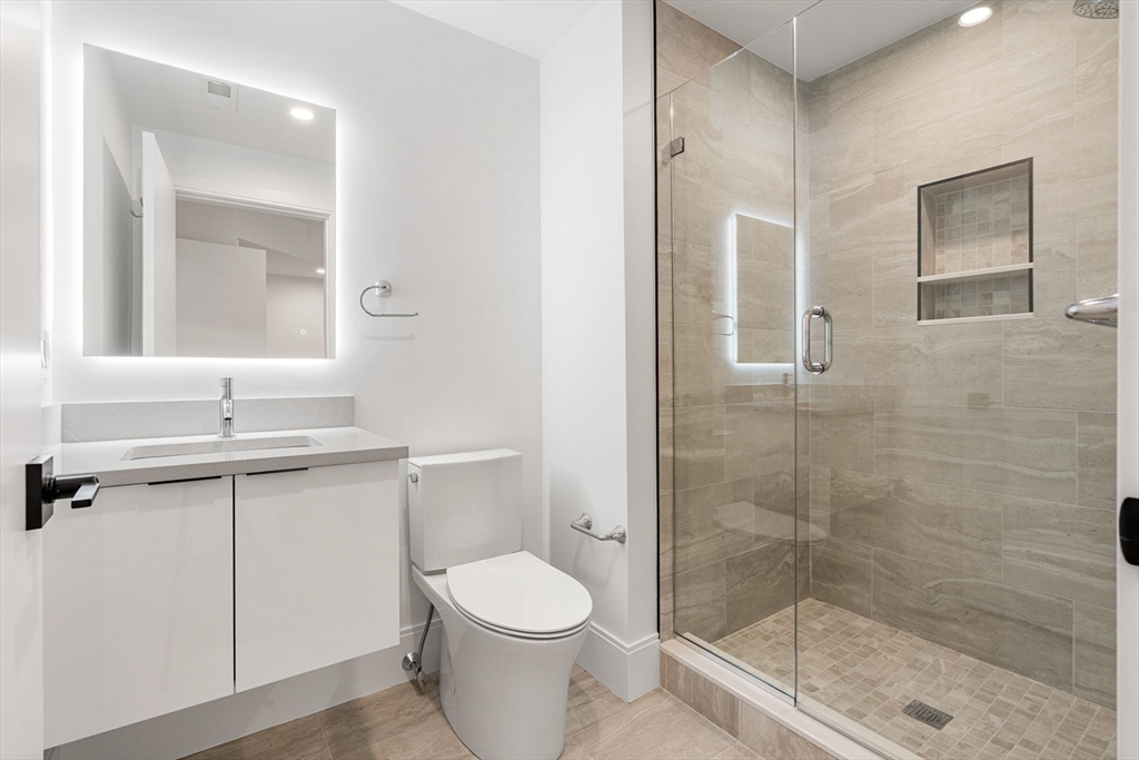 17 Prospect Hill Road Lexington, MA 02421 - Photo 38 of 42 a bathroom with a toilet a sink and shower