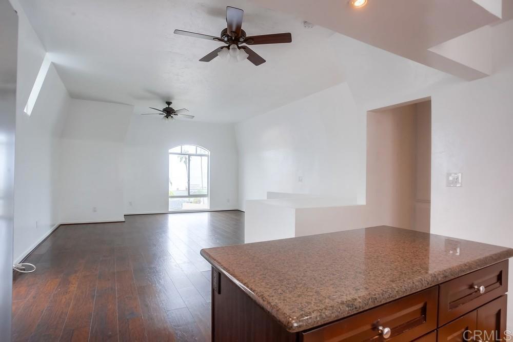1295 Prospect Street, Unit D La Jolla, CA 92037 - Photo 9 of 24 wooden floor in an empty room with a window