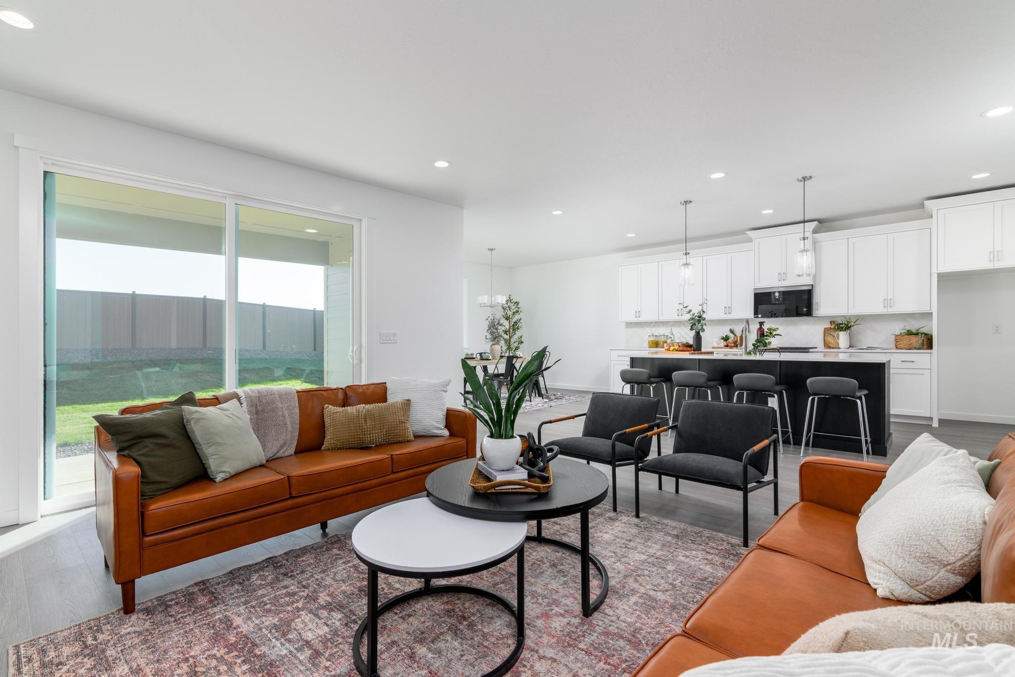 1932 Chokecherry Avenue Middleton, ID 83644 - Photo 2 of 11 Living room with dark wood-style flooring and recessed lighting