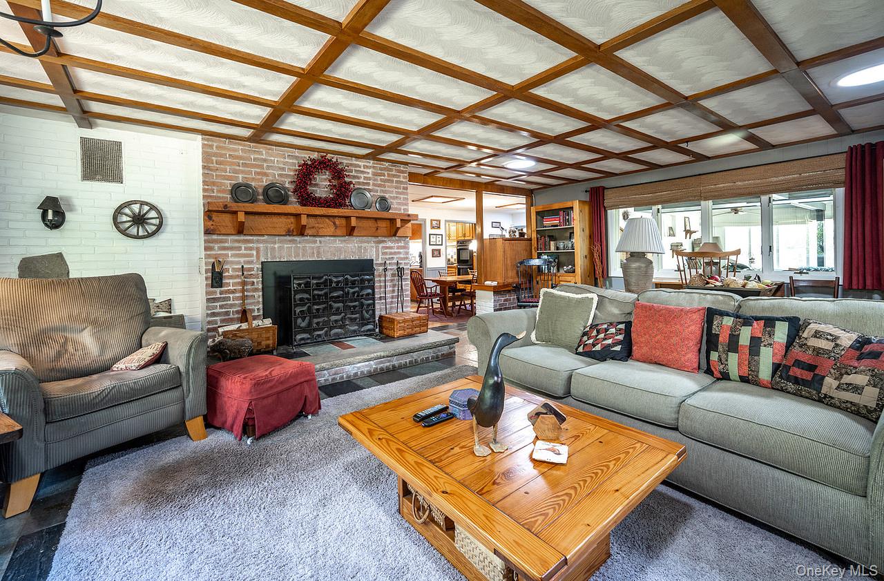 53 Tyrrel Road Pleasant Valley, NY 12569 - Photo 11 of 35 a living room with furniture a fireplace and a table