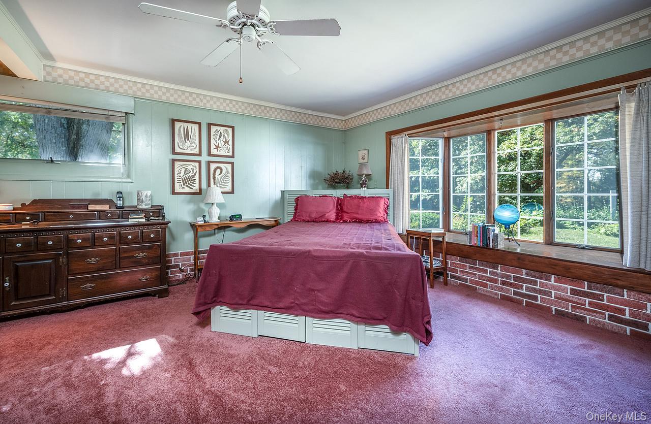53 Tyrrel Road Pleasant Valley, NY 12569 - Photo 19 of 35 a spacious bedroom with a bed and a chandelier