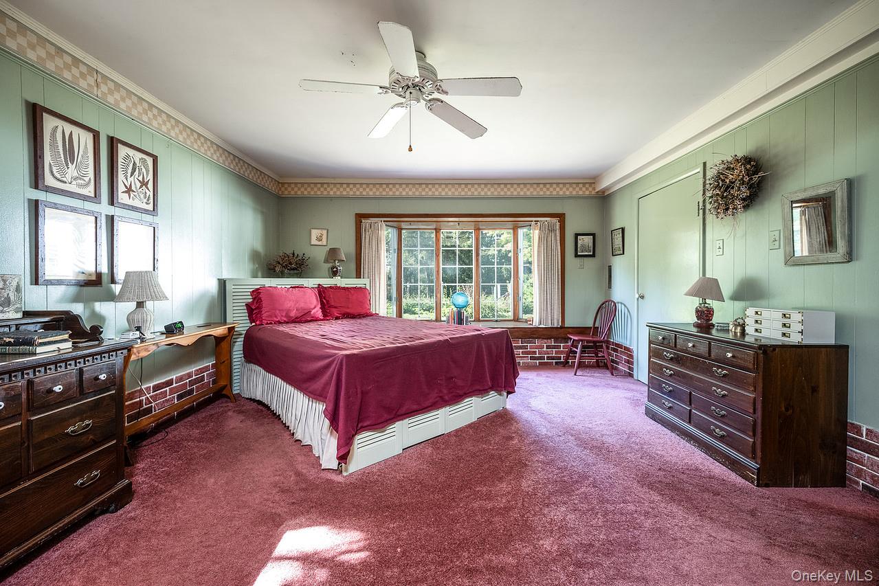 53 Tyrrel Road Pleasant Valley, NY 12569 - Photo 20 of 35 a spacious bedroom with a bed and a dresser next to a window