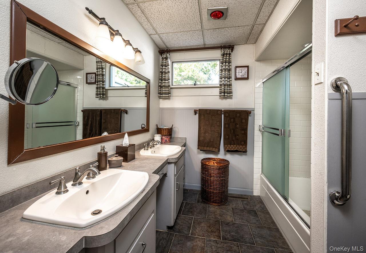 53 Tyrrel Road Pleasant Valley, NY 12569 - Photo 23 of 35 a en suite bathroom with a sink a mirror and a shower