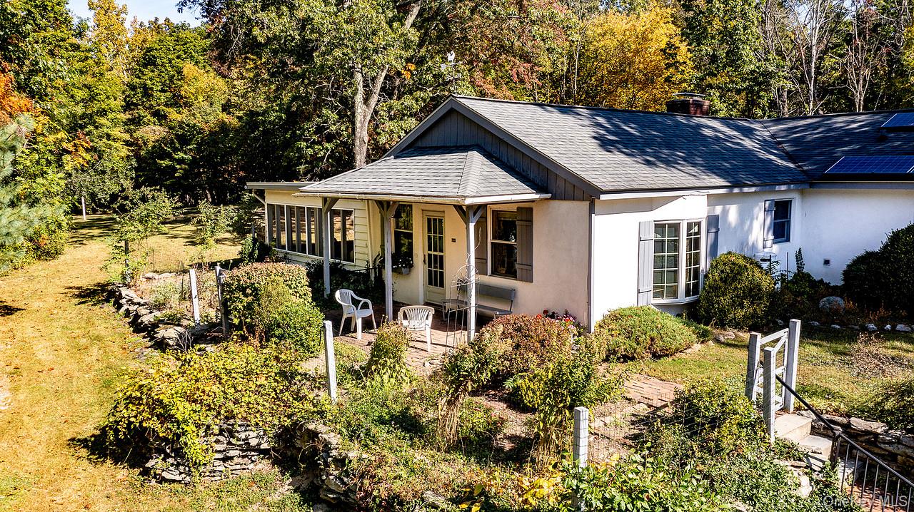 53 Tyrrel Road Pleasant Valley, NY 12569 - Photo 3 of 35 a patio with table and chairs and potted plants