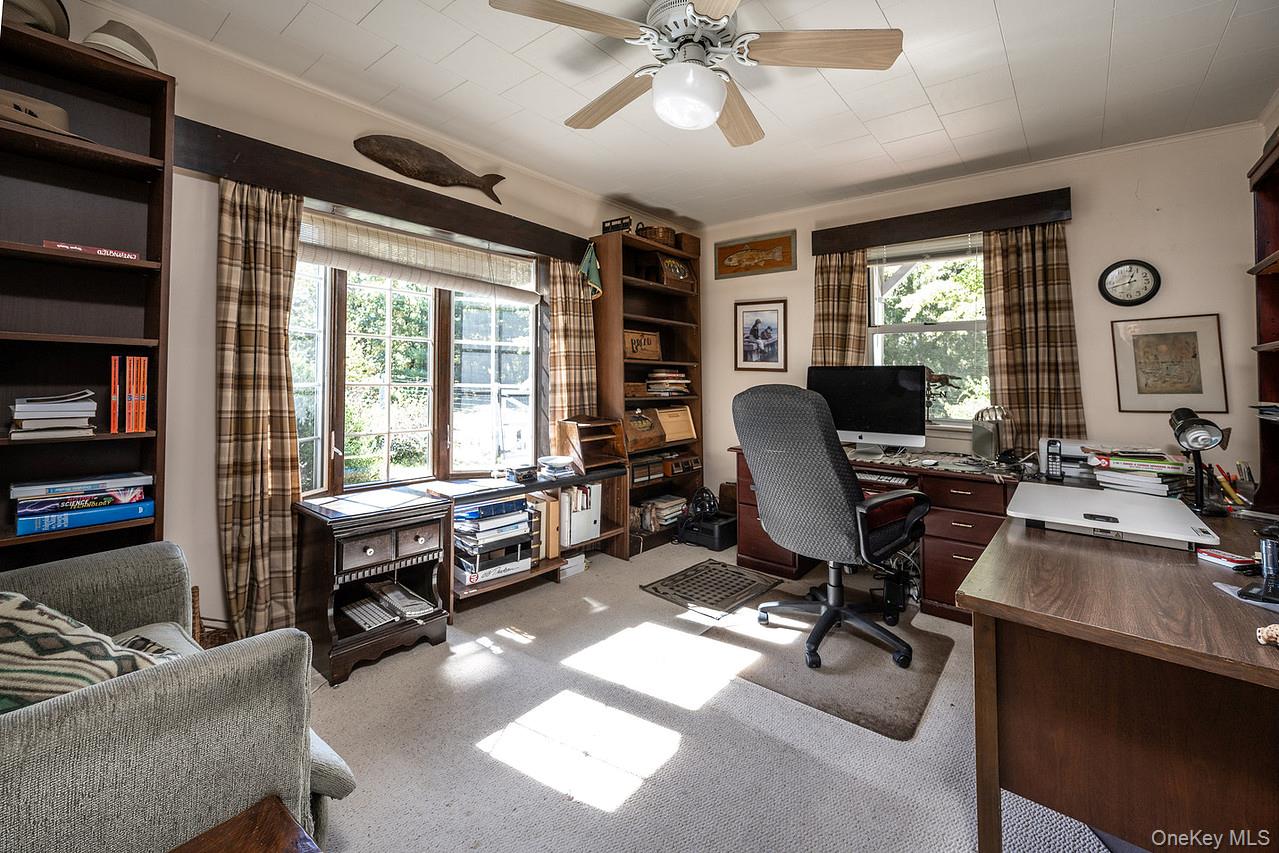53 Tyrrel Road Pleasant Valley, NY 12569 - Photo 10 of 35 a view of a workspace with furniture and a window