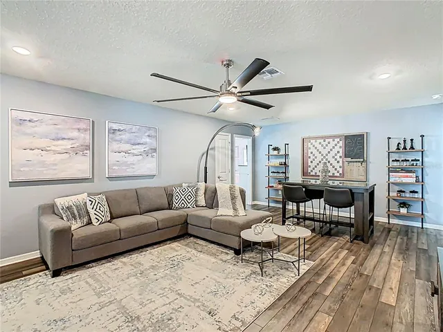 a view of a dining room with furniture and wooden floor