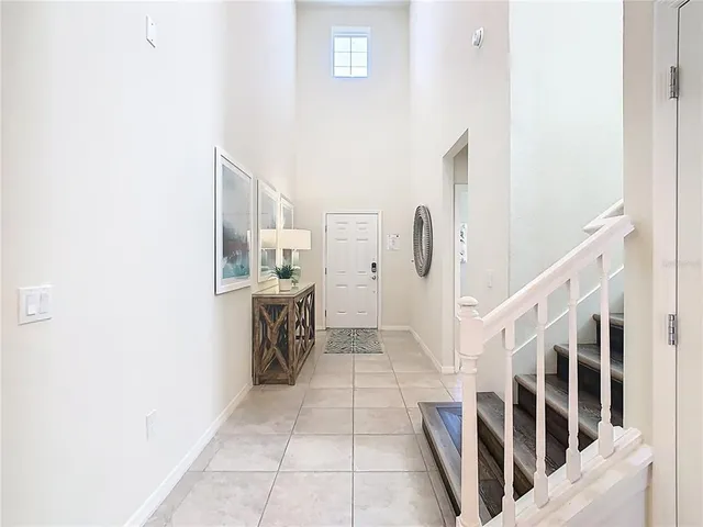 a view of entryway with furniture and wooden floor