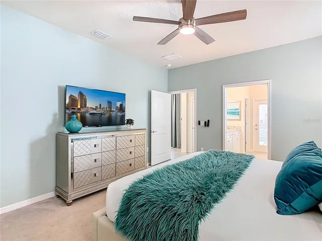 a spacious bathroom with a granite countertop tub sink a mirror a shower and vanity