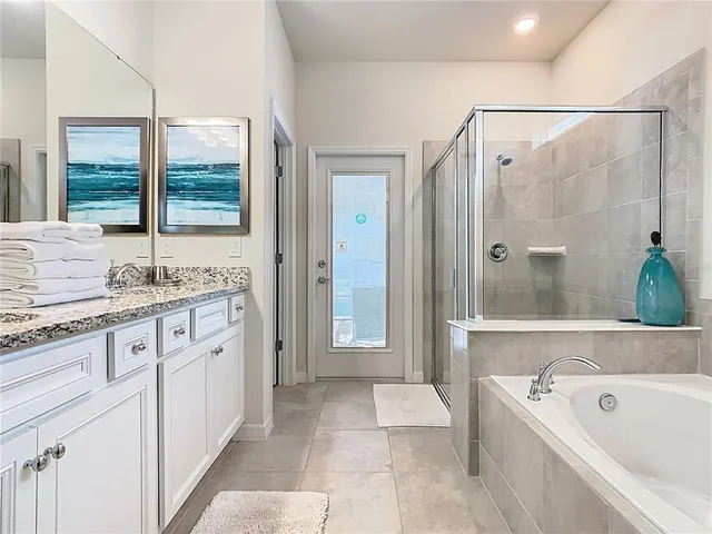 a view of an empty room with cabinet and entryway