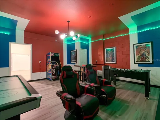 a view of hall way with furniture and rug