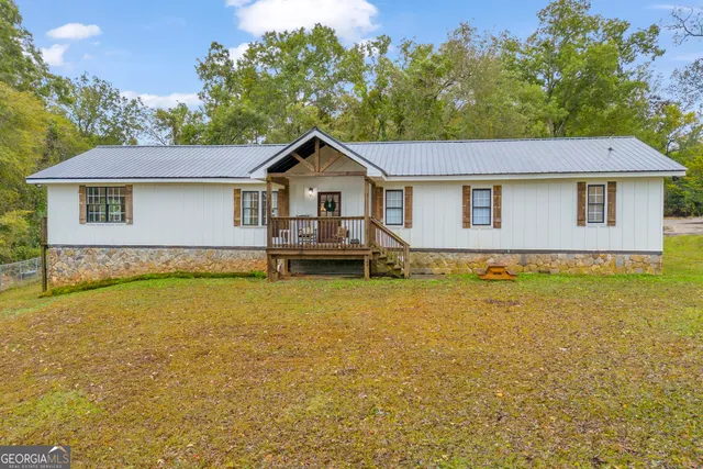 a view of a house with pool and a outdoor view