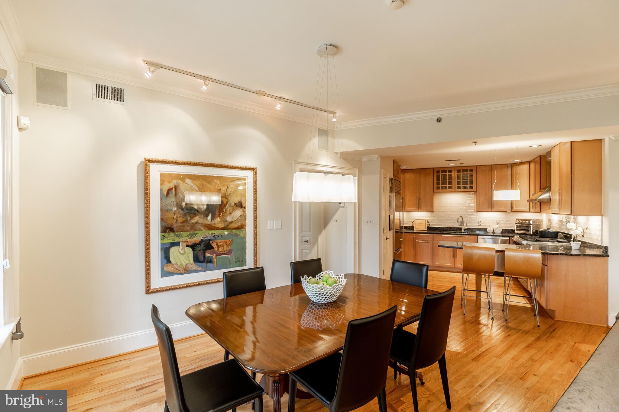 1882 Columbia Road Northwest, Unit 304 Washington, DC 20009 - Photo 6 of 28 Dining Room Open to Kitchen with Balcony Access