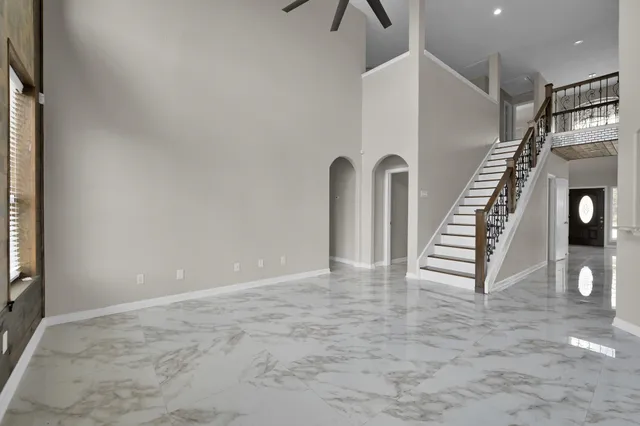a kitchen that has a lot of cabinets in it