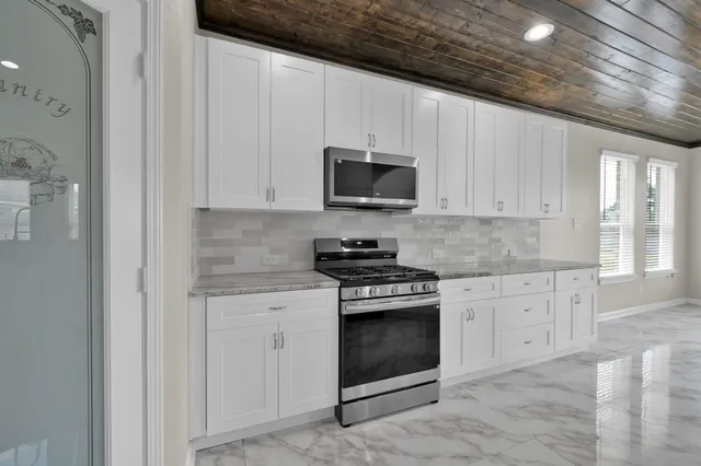 a view of a hallway with windows