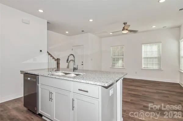 a kitchen with sink and window