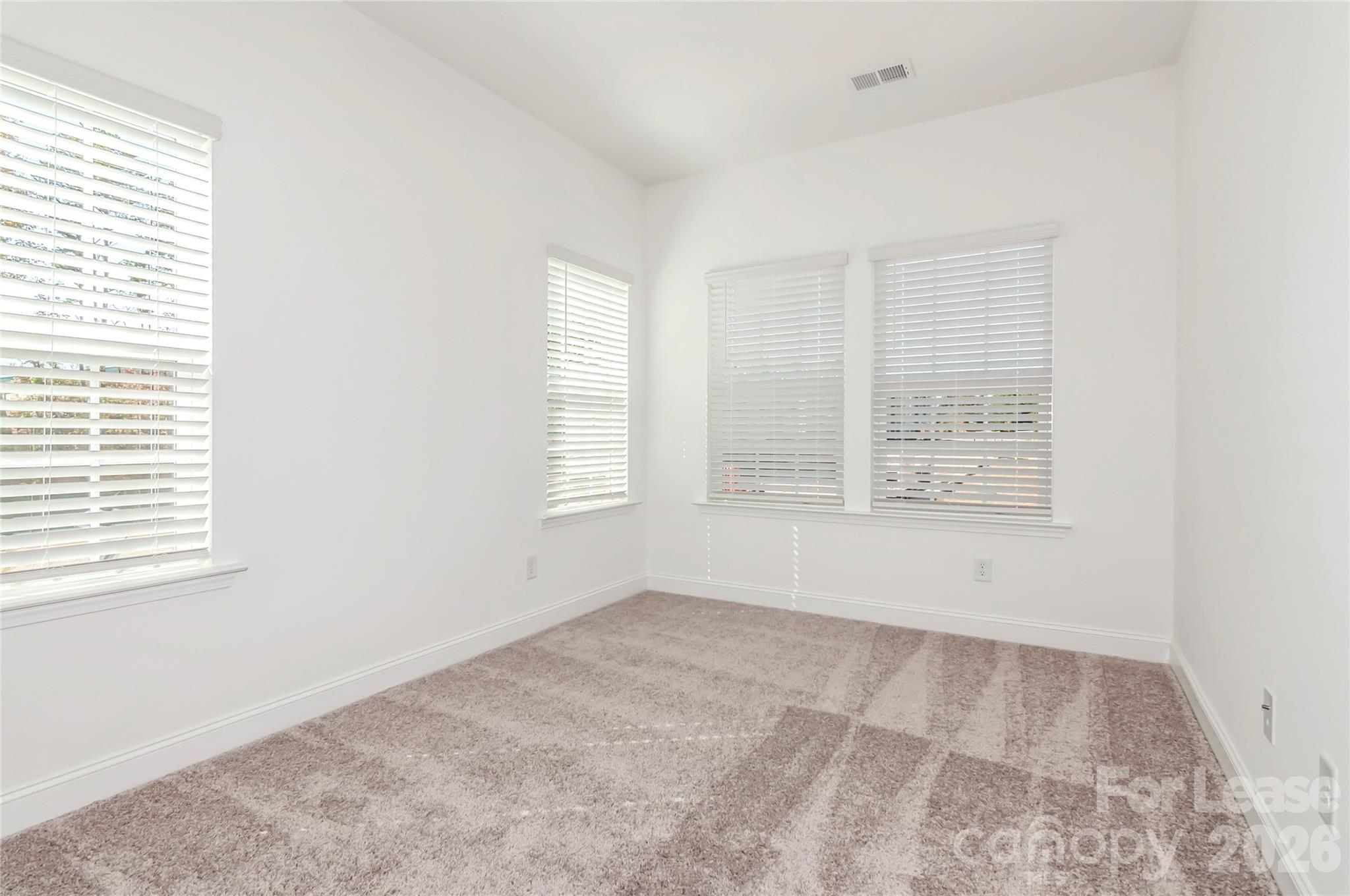 6002 Cedar Chip Way Matthews, NC 28105 - Photo 23 of 35 an empty room with windows