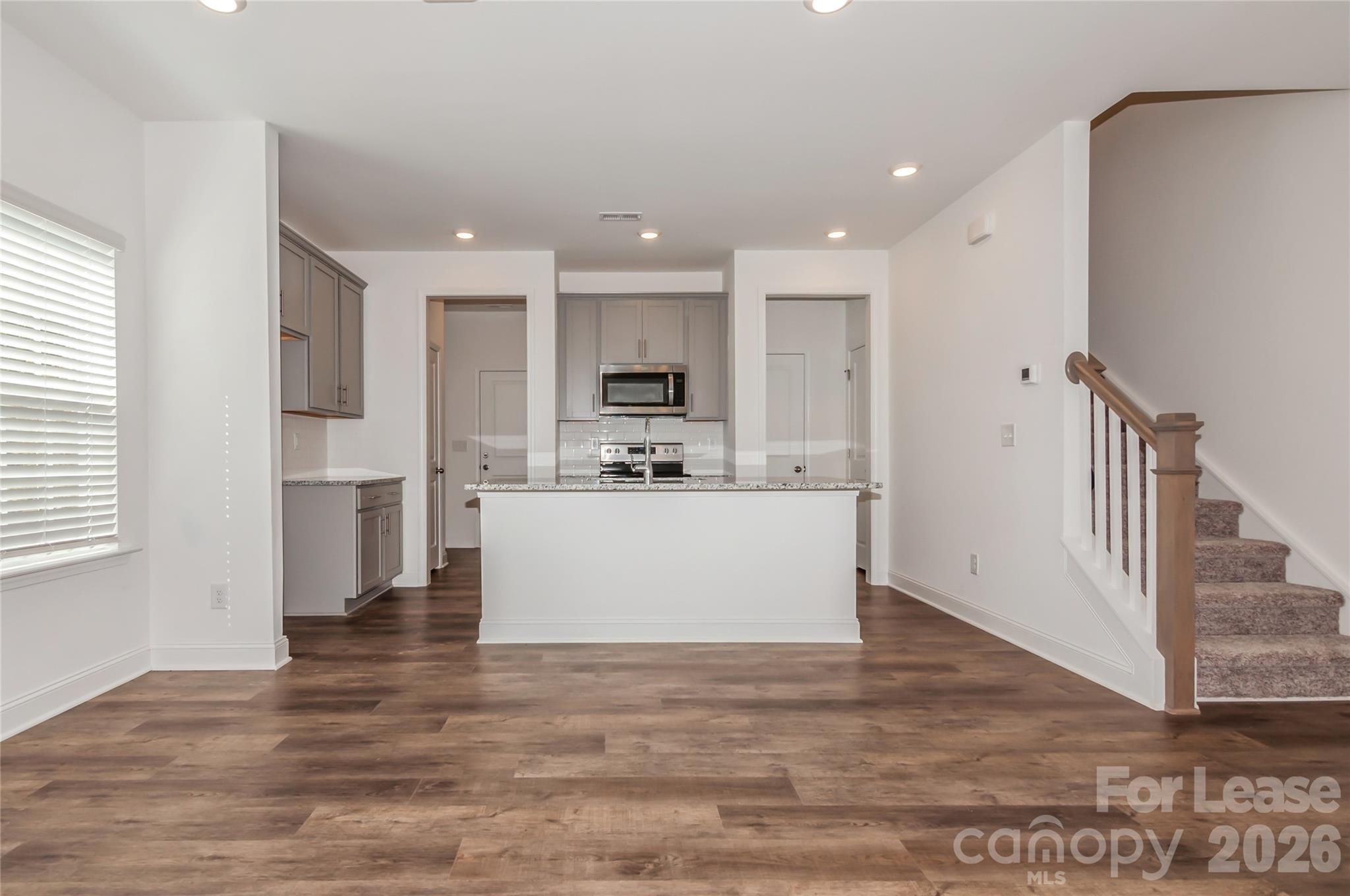 6002 Cedar Chip Way Matthews, NC 28105 - Photo 4 of 35 a view of kitchen with stainless steel appliances refrigerator oven microwave and cabinets