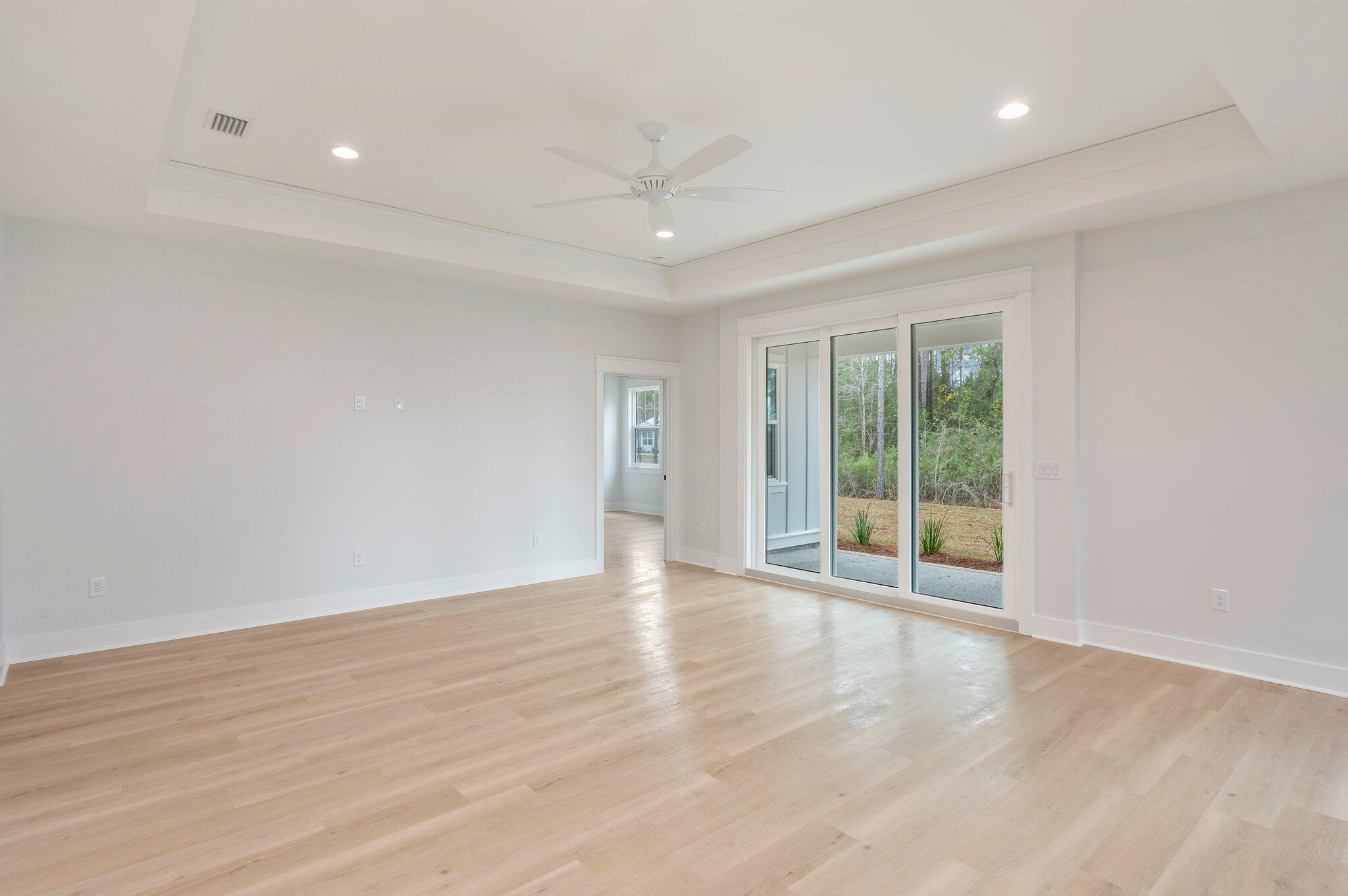 1110 Co Highway 3280 Freeport, FL 32439 - Photo 3 of 39 a view of an empty room with wooden floor and a window