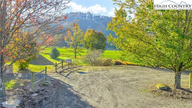 a view of a swimming pool with an outdoor space and seating area