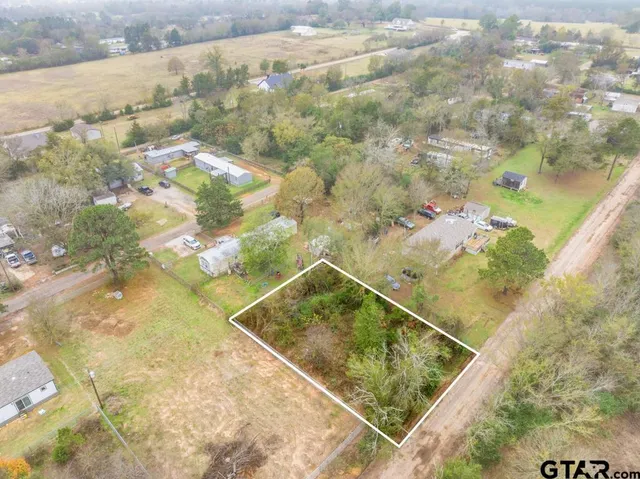 a view of a swimming pool and an outdoor space