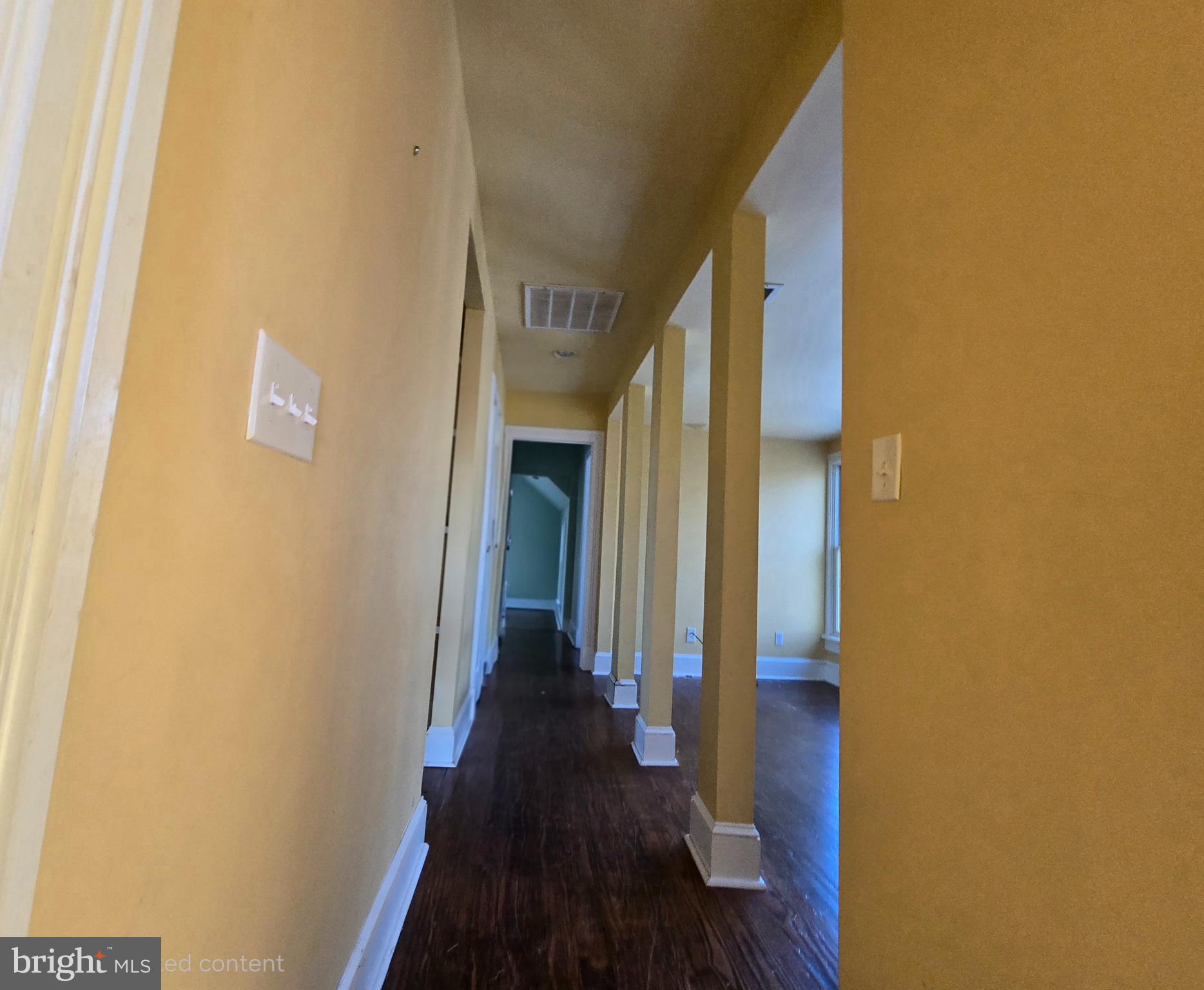 101 Chapel Road Easton, MD 21601 - Photo 11 of 35 a view of a hallway with wooden floor