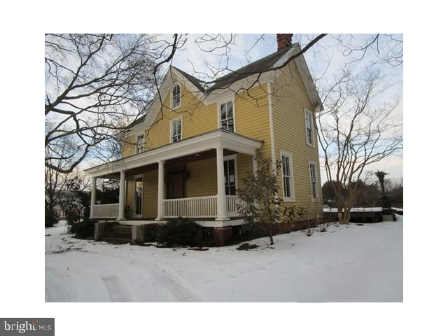 101 Chapel Road Easton, MD 21601 - Photo 2 of 35 a view of a house with a yard covered in snow