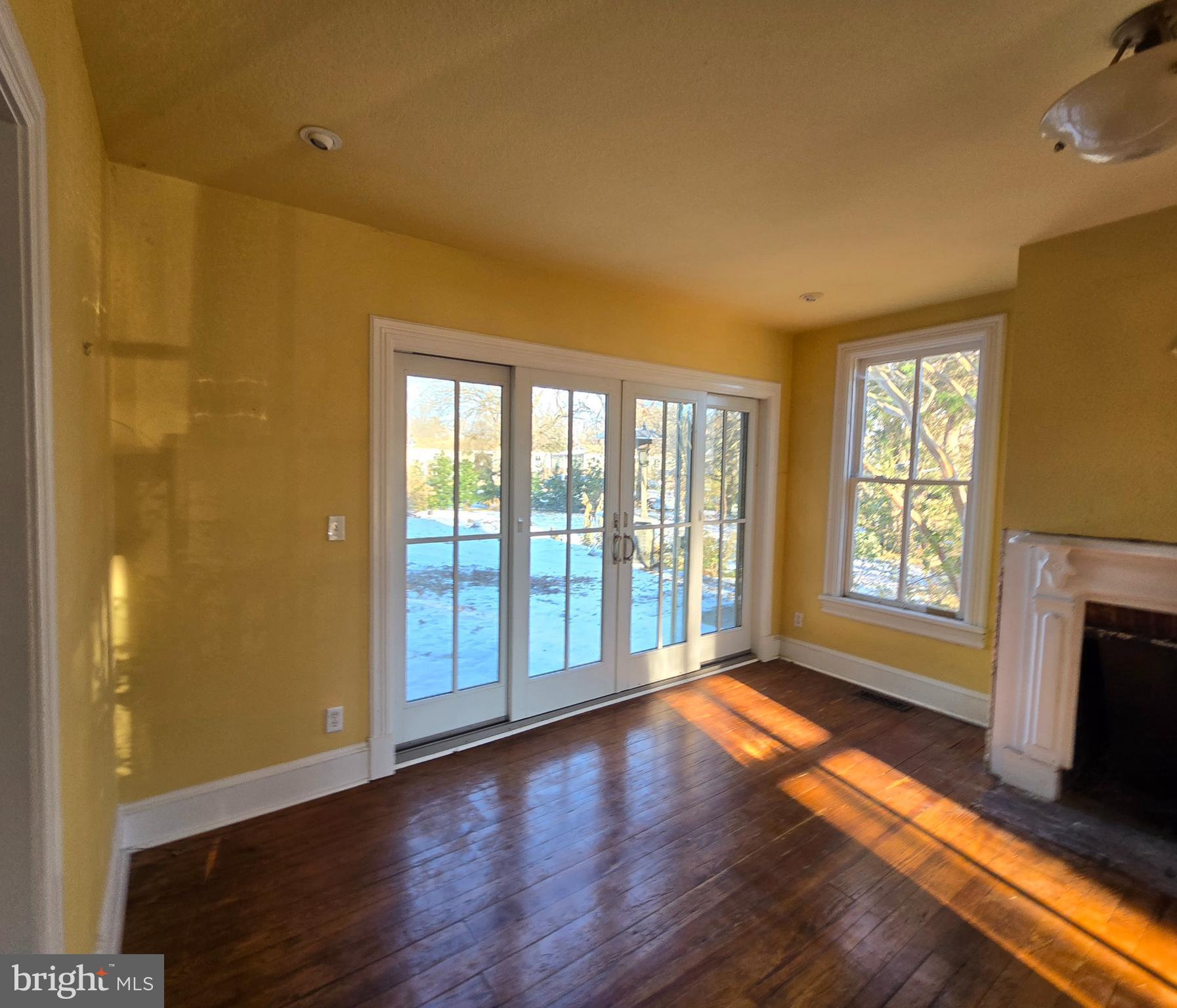 101 Chapel Road Easton, MD 21601 - Photo 23 of 35 a view of an empty room with wooden floor and a window