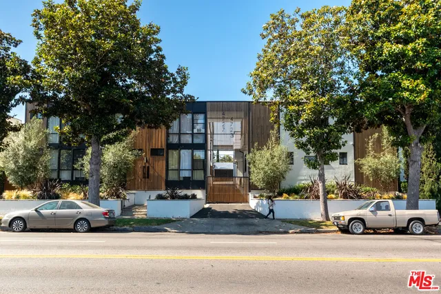a view of street with parked cars