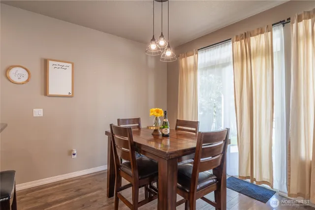 a dining room with furniture and chandelier