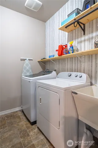 a utility room with dryer and washer