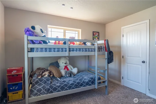 a bedroom with a bed and closet