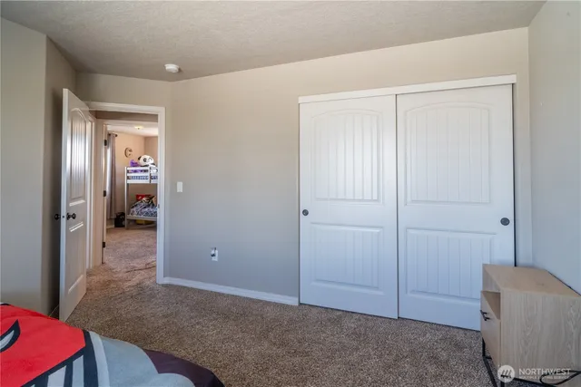 a view of livingroom with hardwood floor and cabinet